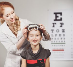 a young girl at an eye exam